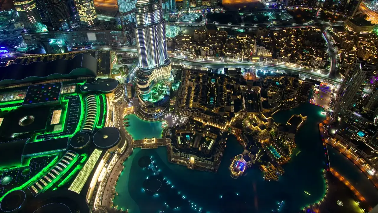Gulf city skyline at night from above